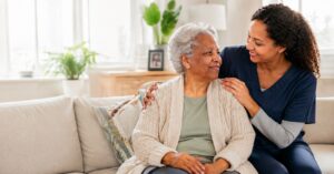 Family caregiver supporting an older adult at home in Massachusetts